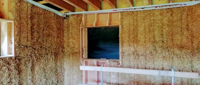 Isolation paille dans maison ossature bois